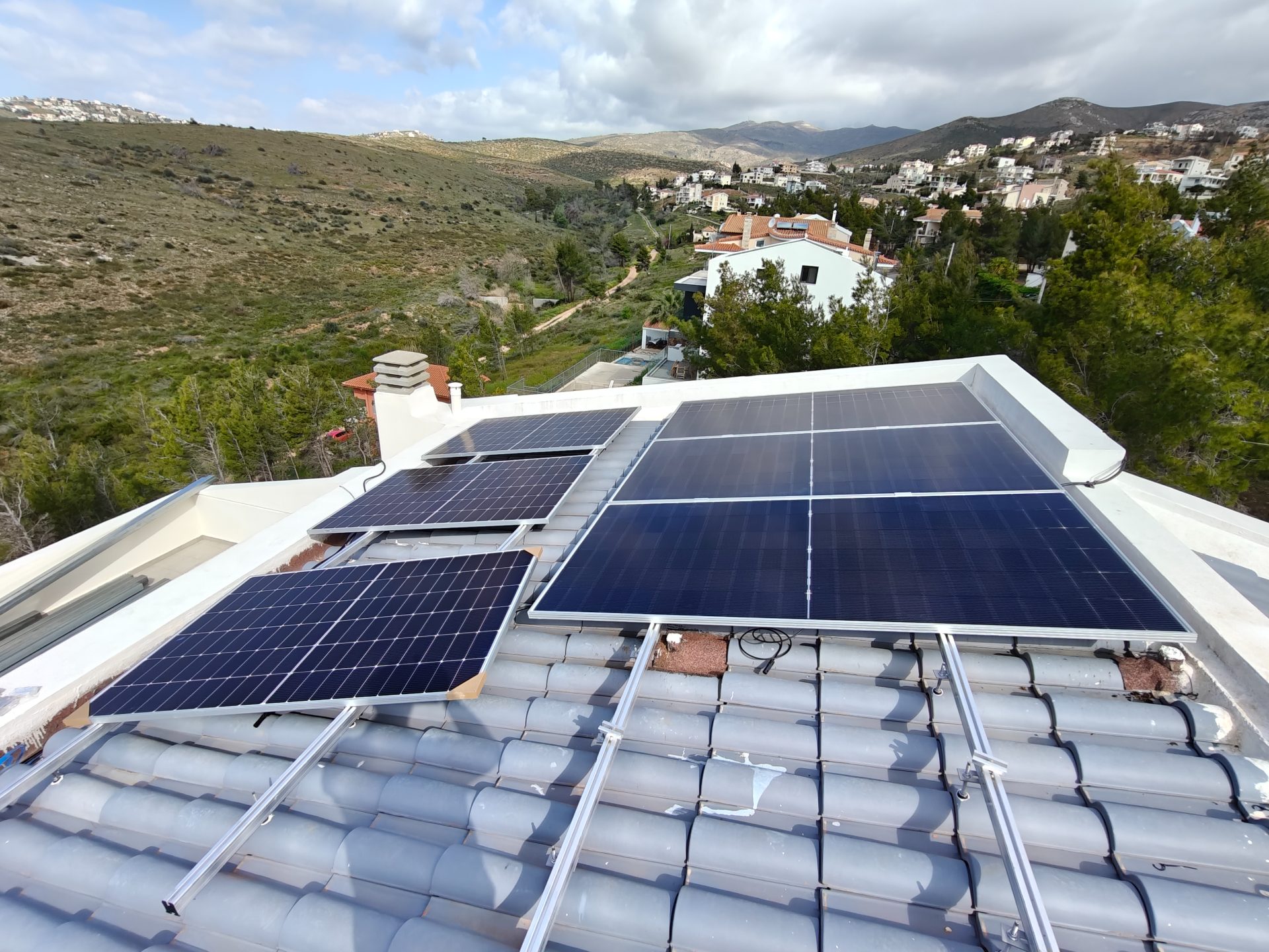 Solar on a tiled roof and on a flat roof of a home